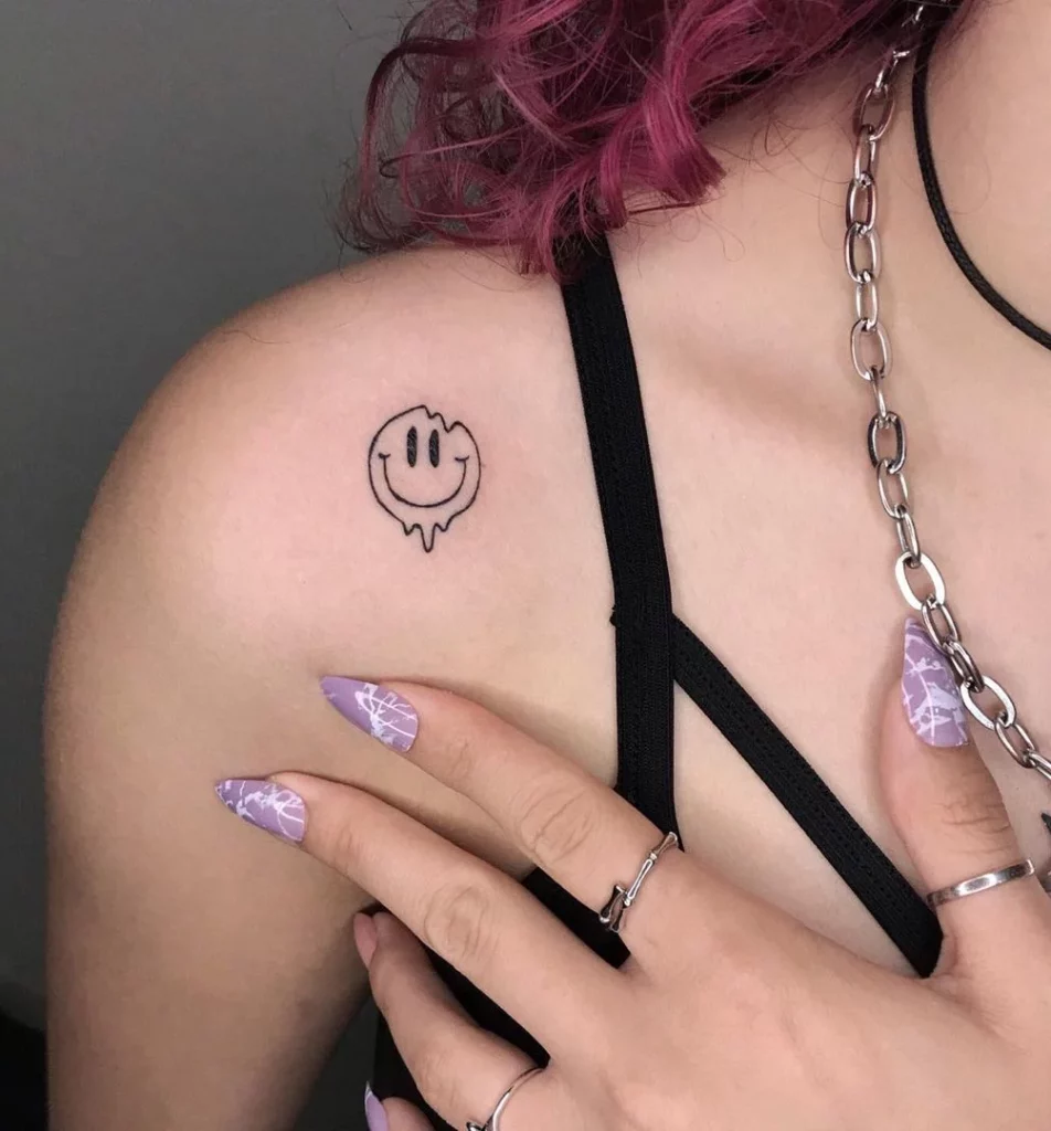 Smiley tattoo on shoulder