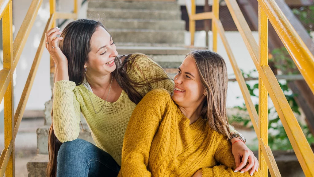 Mother and daughter laughing together