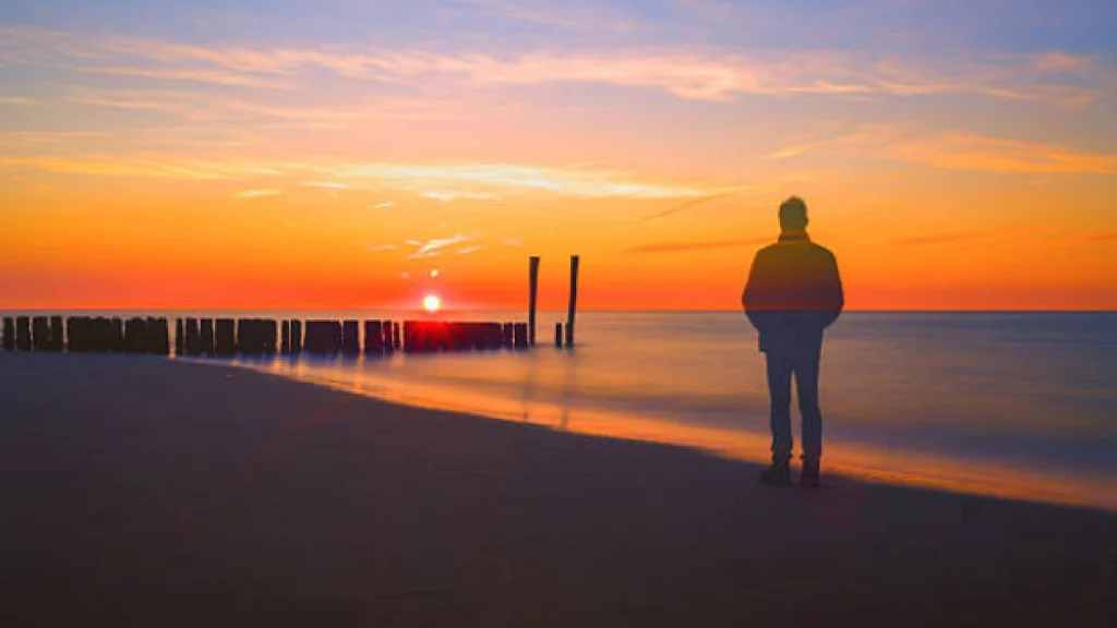 man standing on beach