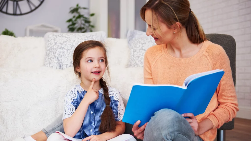 mother teaching her daughter happily