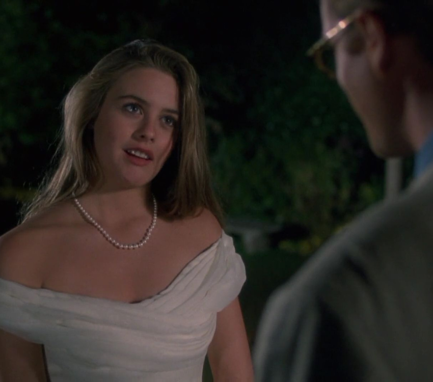 Alicia Silverstone speaking with a man