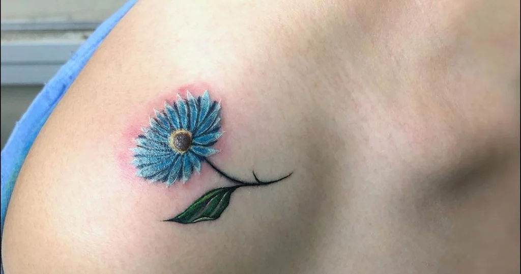 blue daisy shoulder tattoo small