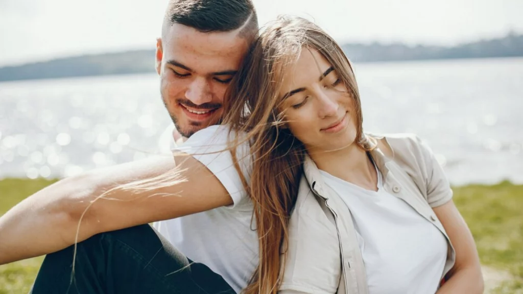 Girl putting head on Boy's shoulder