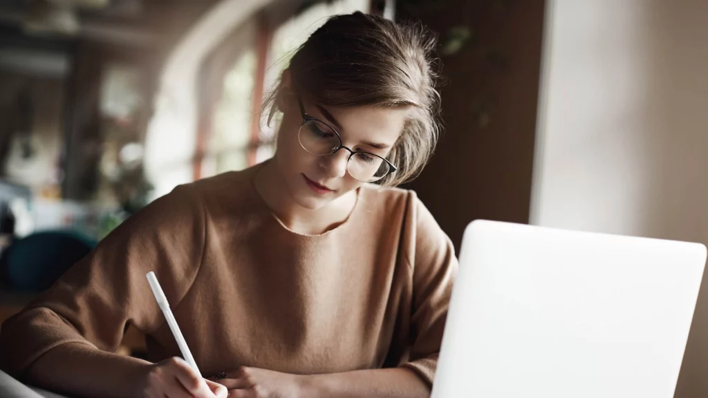 girl studying on her laptop