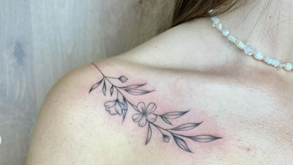 Leaf tattoo with flowers on Shoulder