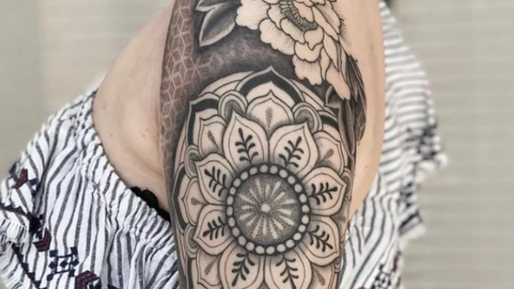 Mandala design on shoulder with flowers