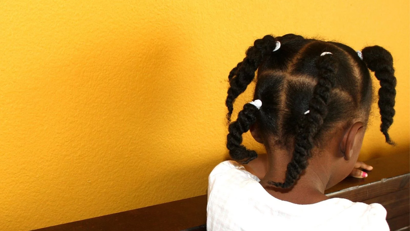 A little girl with African braid hairstyle. 