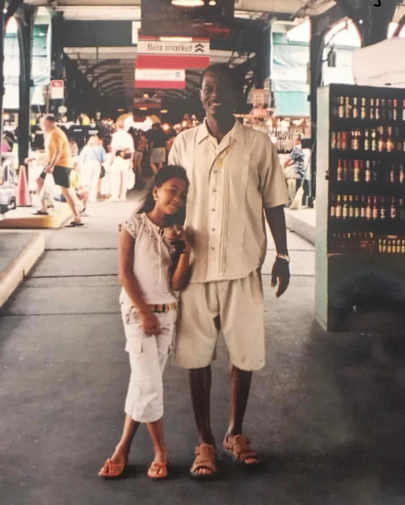 Little Netta Walker with her father wearing white clothes.