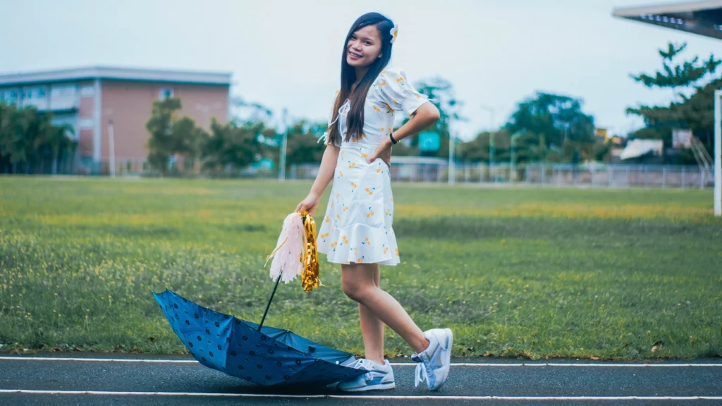 a girl posing in white dress