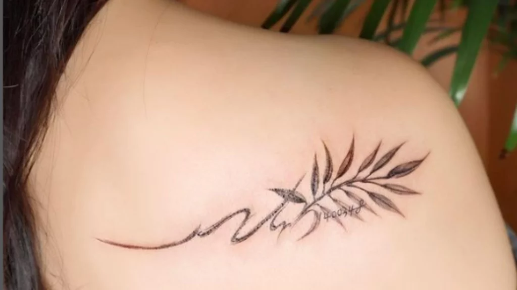 back shoulder leaf tattoo with name