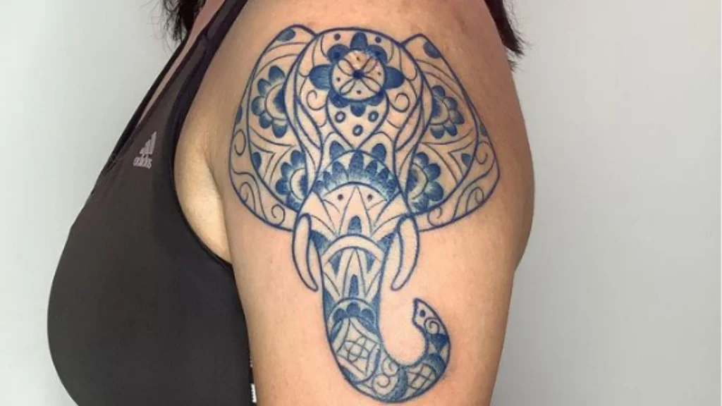 Elephant head tattoo on shoulder