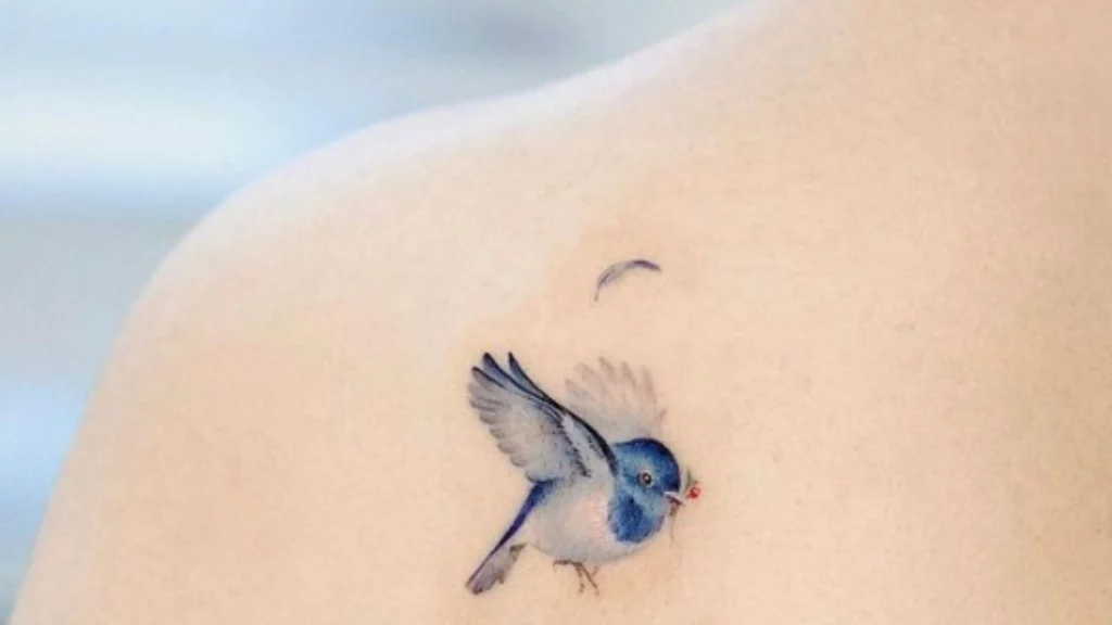 blue sparrow tattoo on shoulder