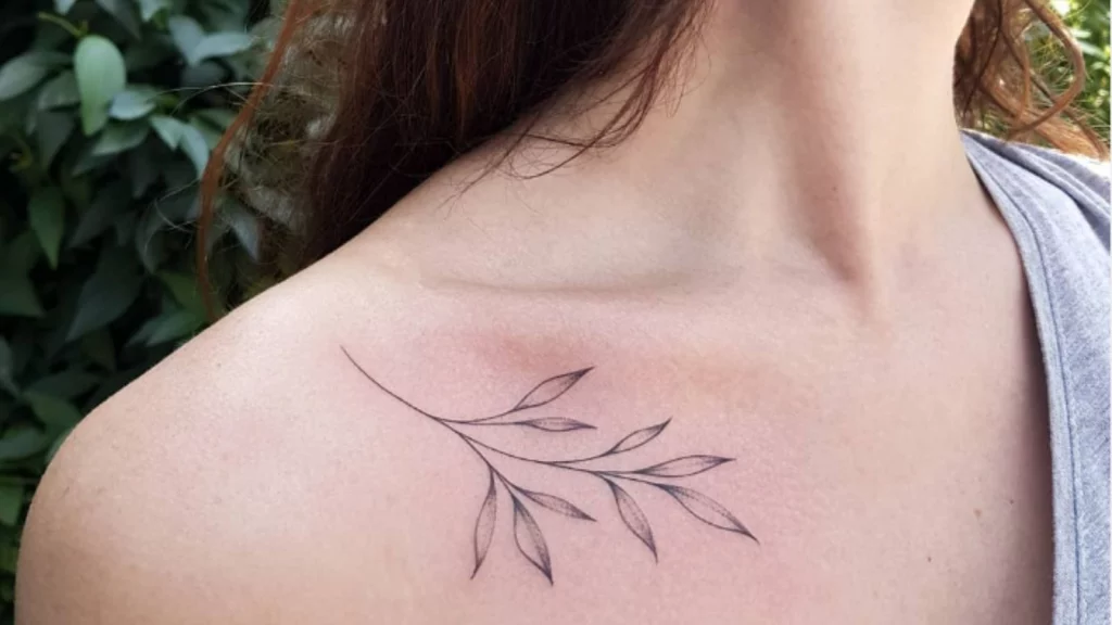 Leaf tattoo on front shoulder