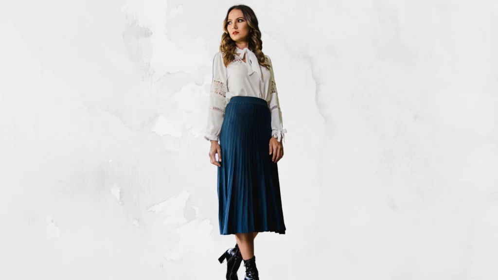 A girl wearing Accorded pleated skirt in blue shade
