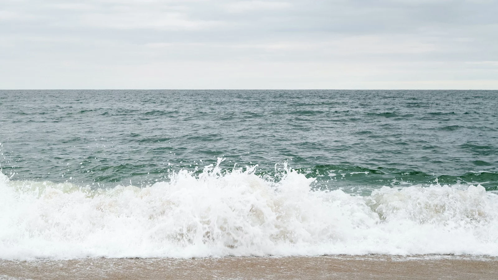 Waves splashing at the Absury Park beach in new york city