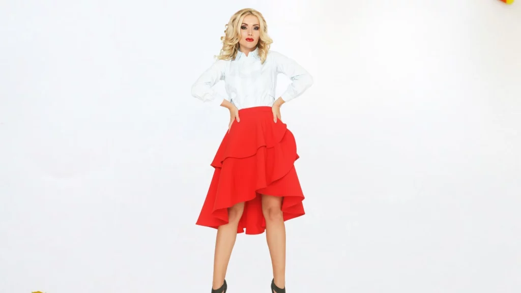A girl wearing red colored asymmetrical skirt