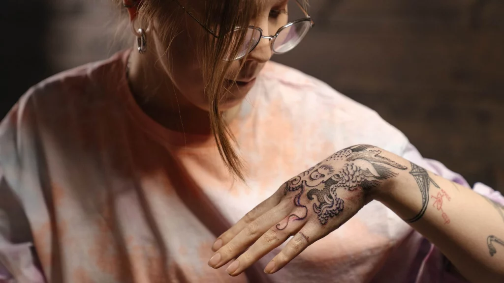 hand dragon tattoo