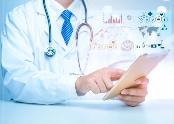 Image featuring functions of PCNOK. doctor wearing a stethoscope and checking data on tab.