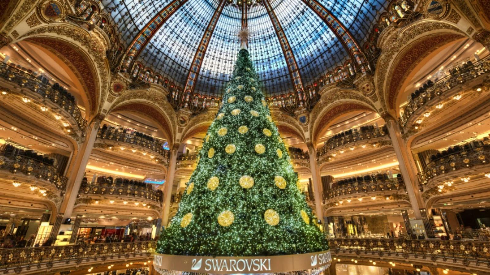 A huge Christmas tree with decorations.