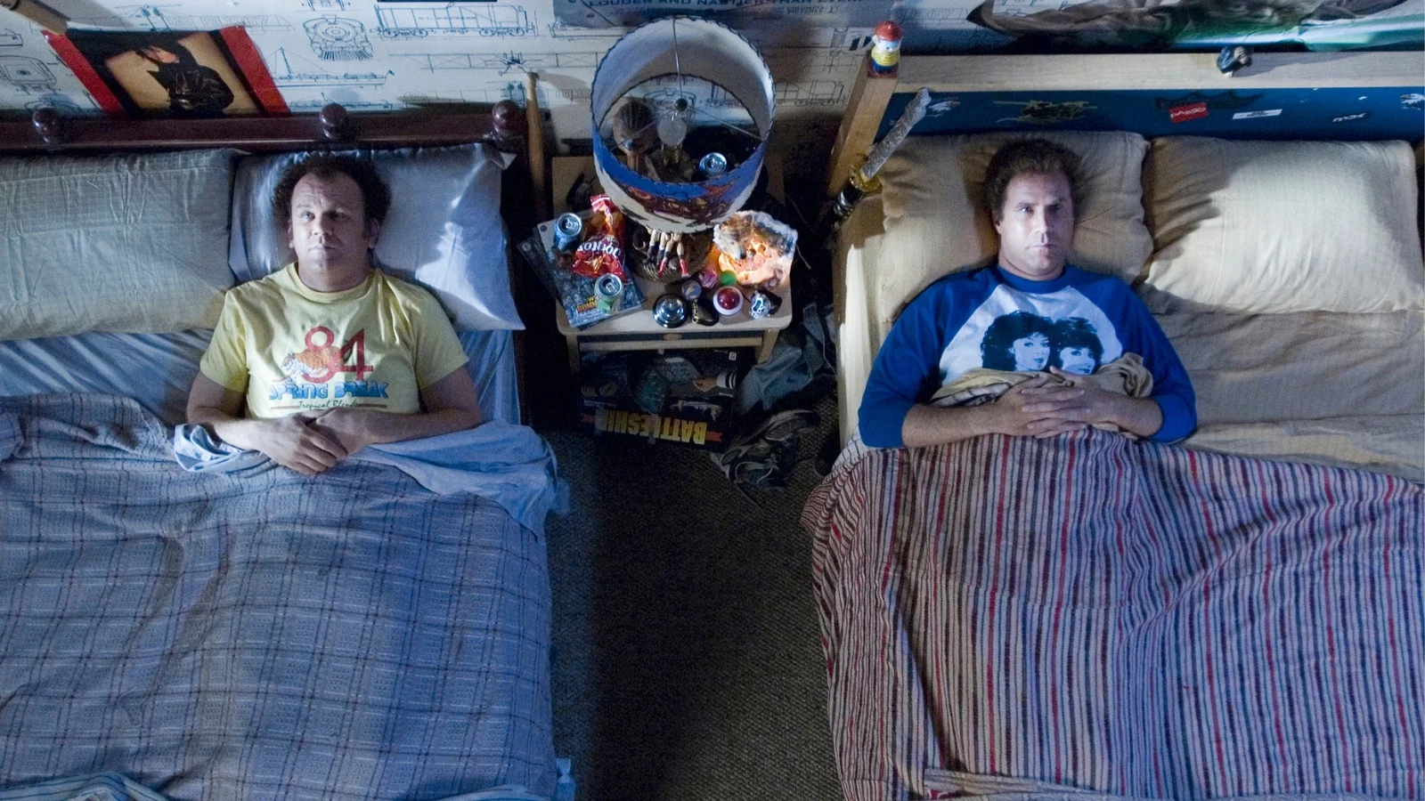The two step brothers lying in adjacent beds. 