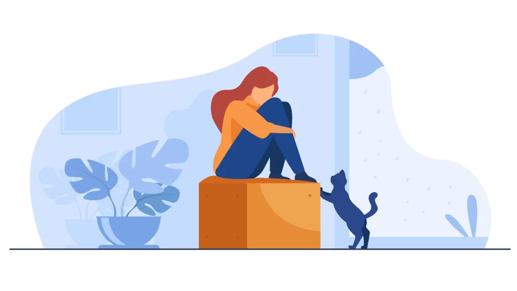Girl sitting on a box and a cat is trying to reach her.
