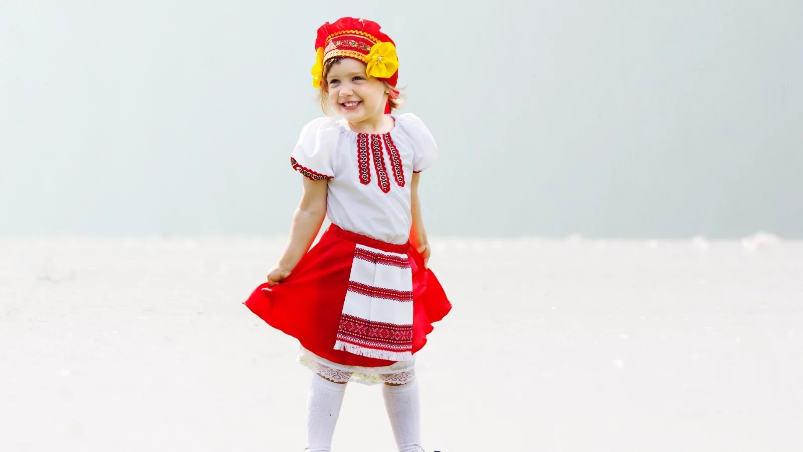 A little girl flaunting her traditional dress. 