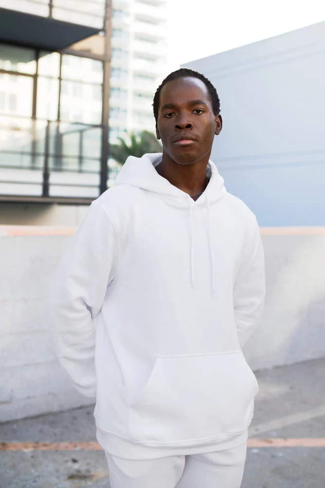 A man in all white hoodie and jogger. 