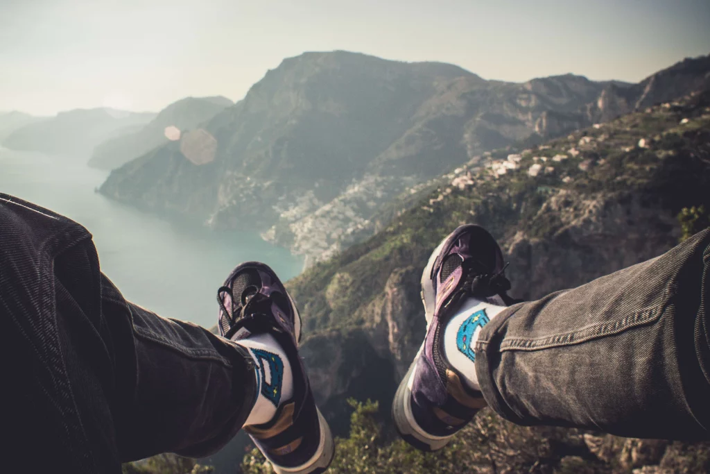 a man sitting on cliff