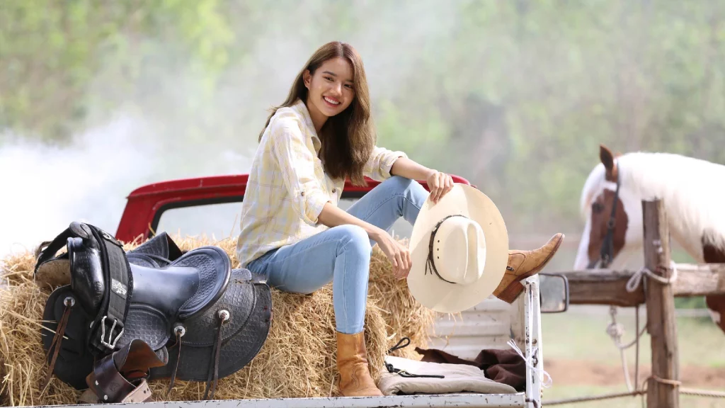 Girl sitting on car