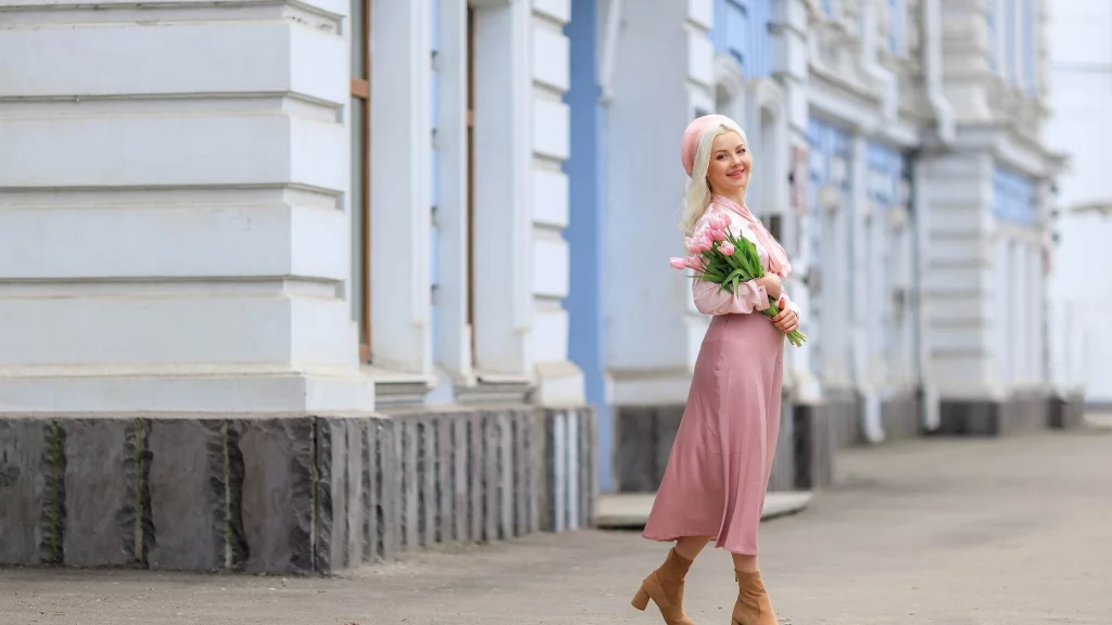 a girl dressing in pink walking