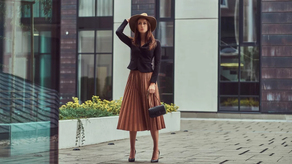 girl with black top and copper skirt