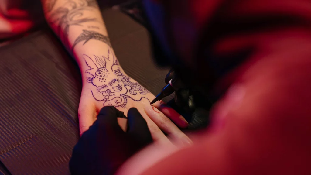 outline tattoo on hand 