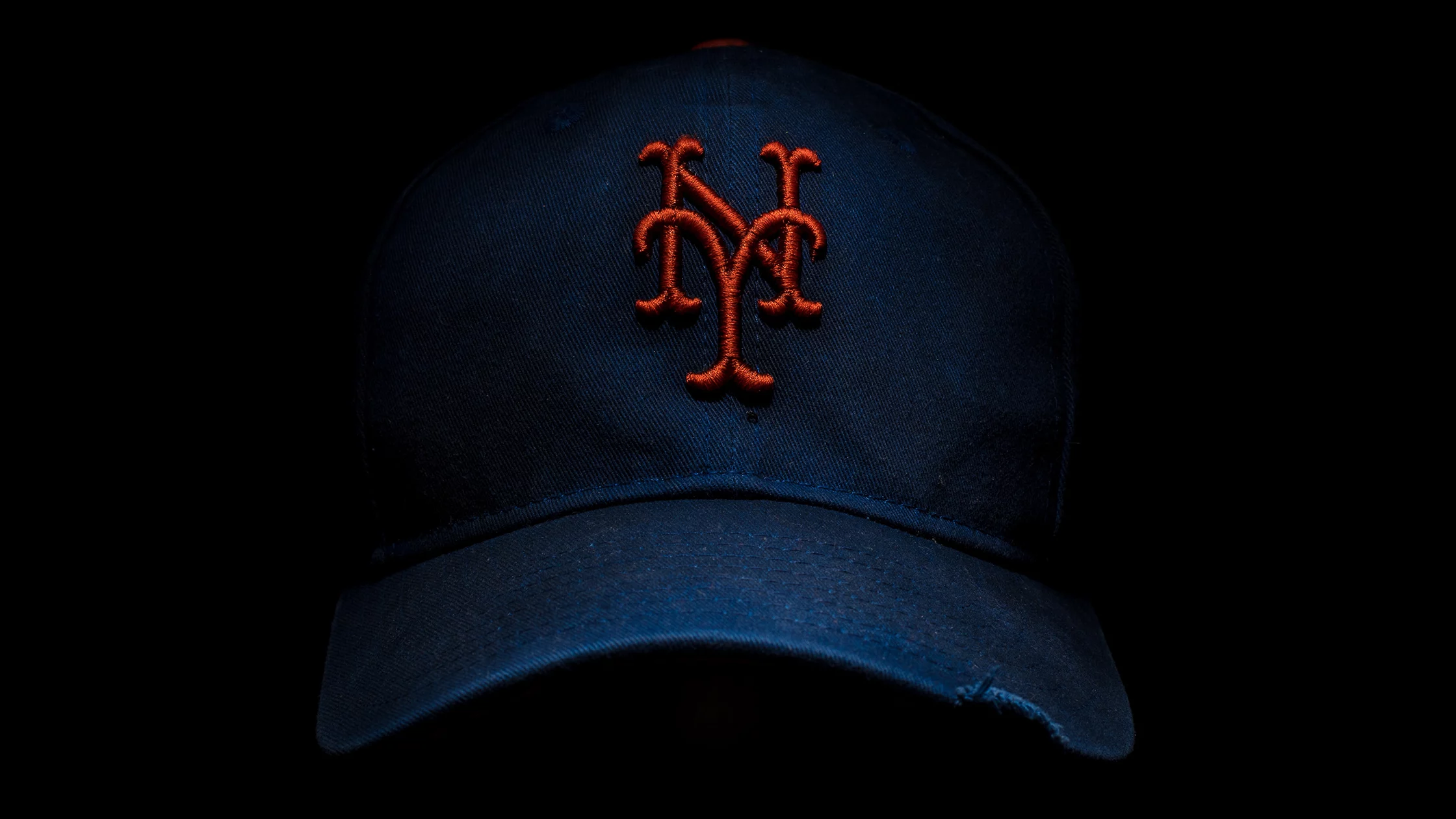 A blue coloured Baseball cap. 