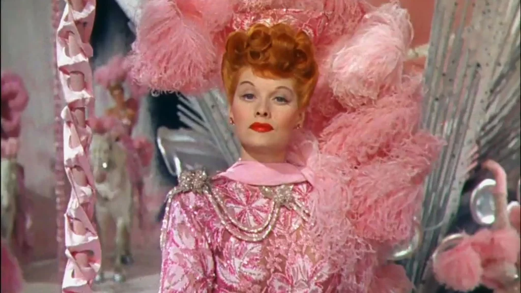 Lucille Ball in pink dress