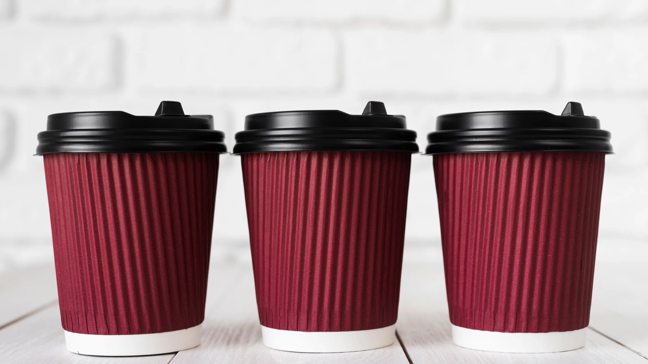 Durable and disposable red coffee cups. 