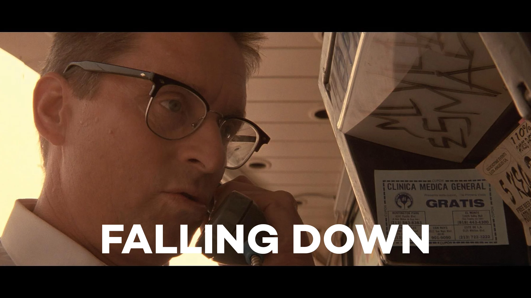A scene from falling down with a man in spectacles. 