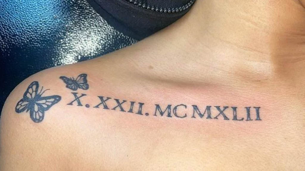 tattoo from shoulder to collar bone in roman numbers