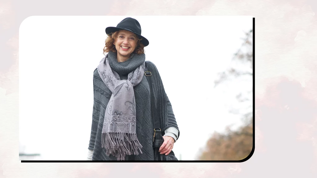 A girl wearing a winter Hat and Scarf.