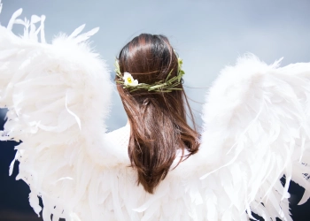women wearing white angel wings