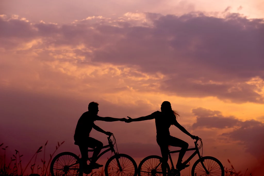a man and women riding bicycle