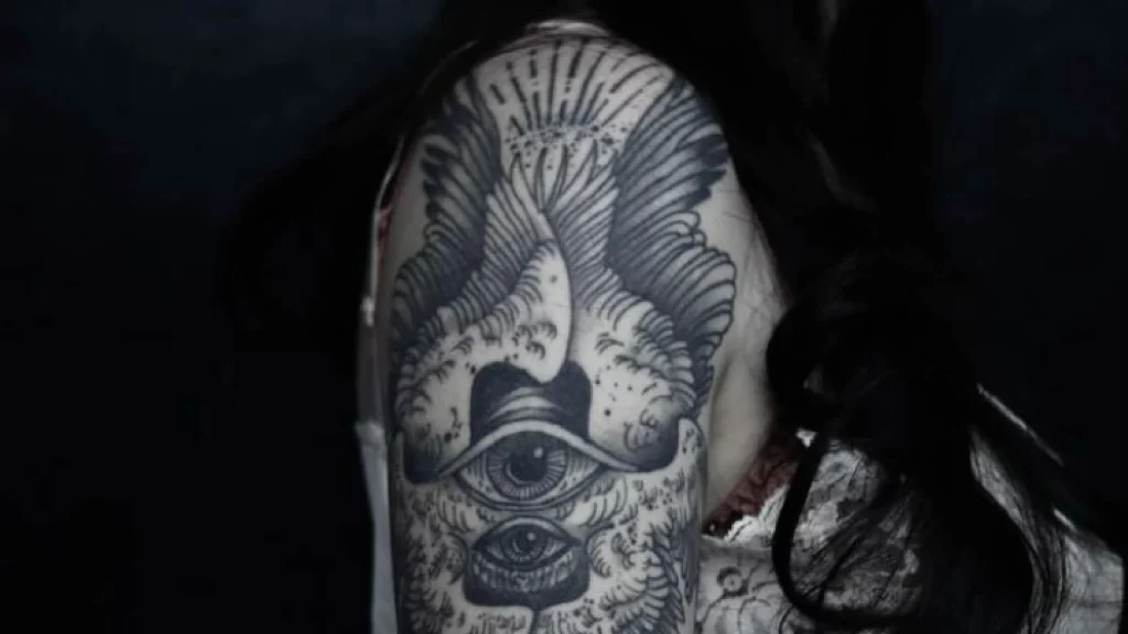 Gothic tattoos on shoulder