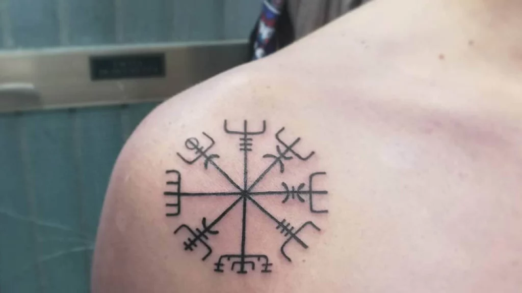 symbol tattoo on shoulder