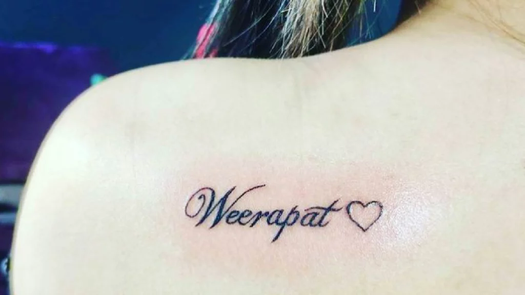 Font tattoo on back shoulder